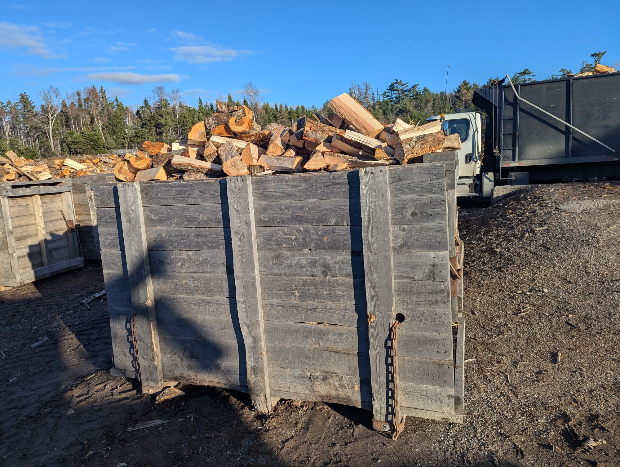 Full cord of split hardwood firewood in a measurement bin